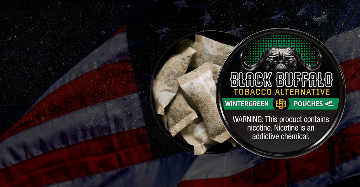 Open Black Buffalo Wintergreen tin held over an American flag